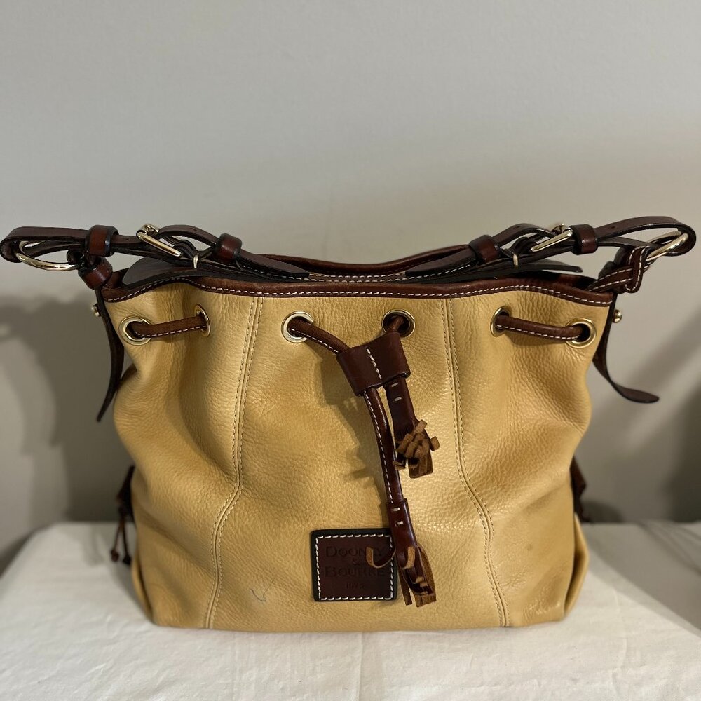 Vintage Dooney & Bourke leather bucket bag, tan and brown color.